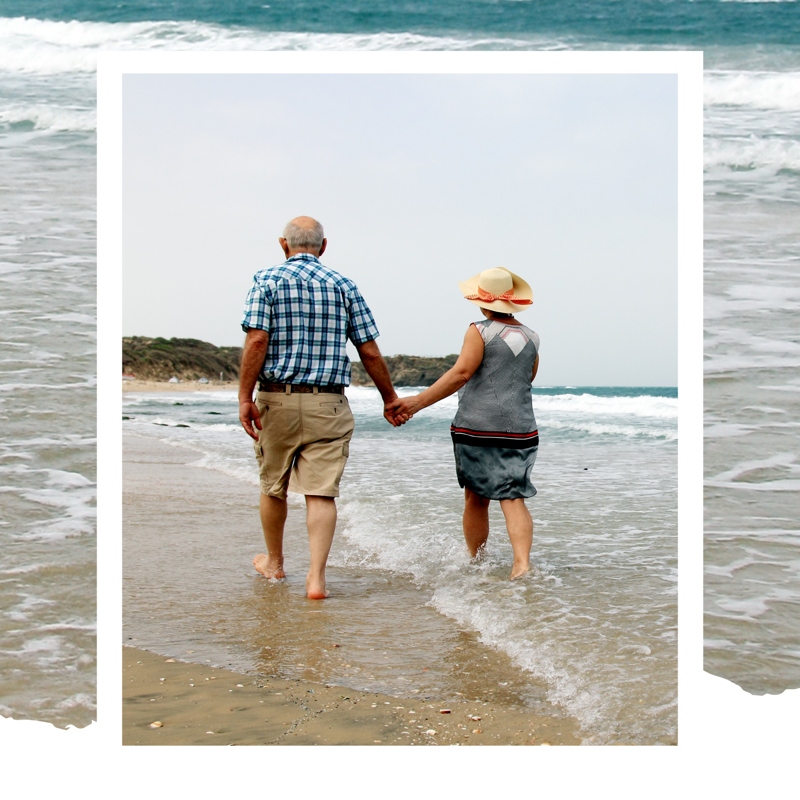 content couple wades on beach for hero section